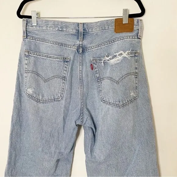 Levis women Baggy Dad Jeans Bin Day 29x30 vtg 90s light wash distressed hole
