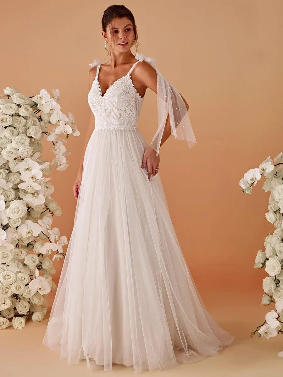 Robe de mariée romantique en dentelle et tulle avec épaules nouées