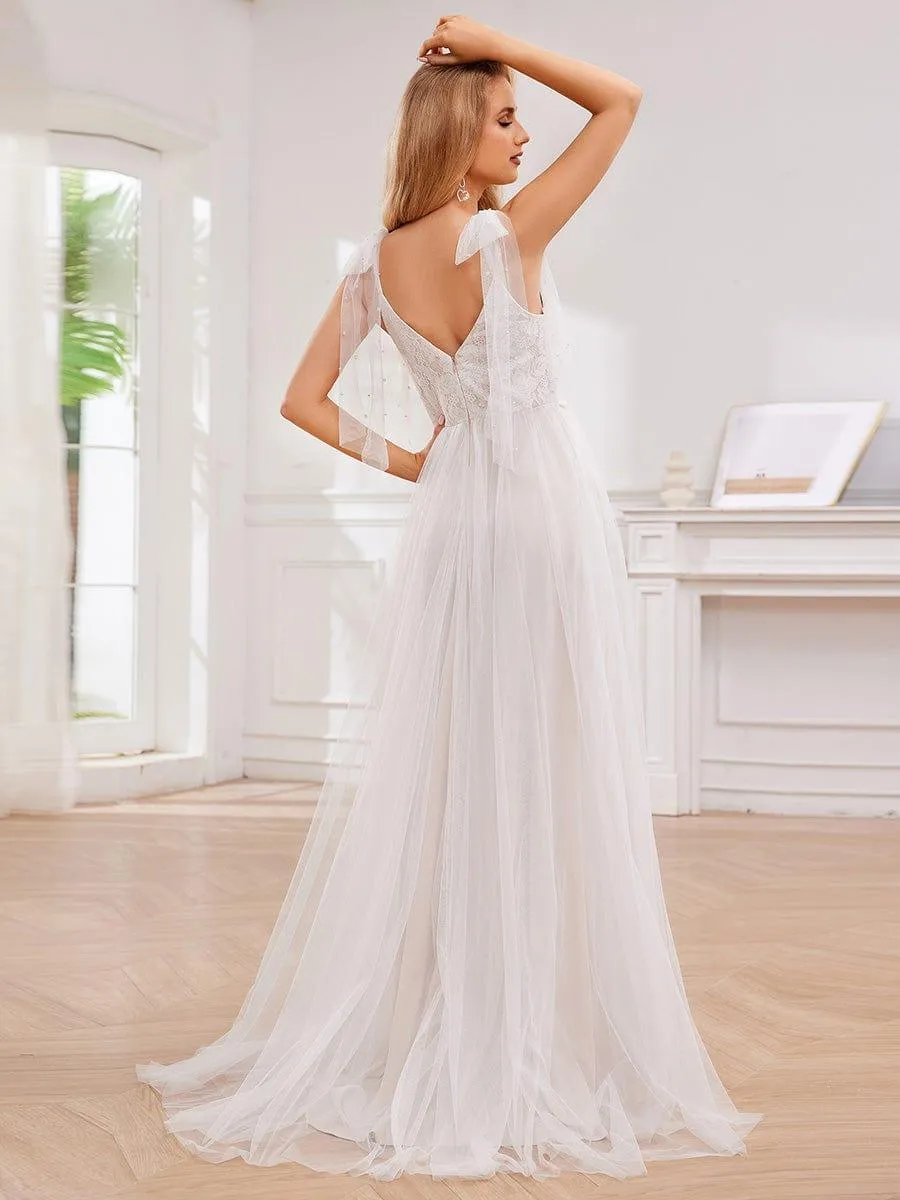 Robe de mariée romantique en dentelle et tulle avec épaules nouées