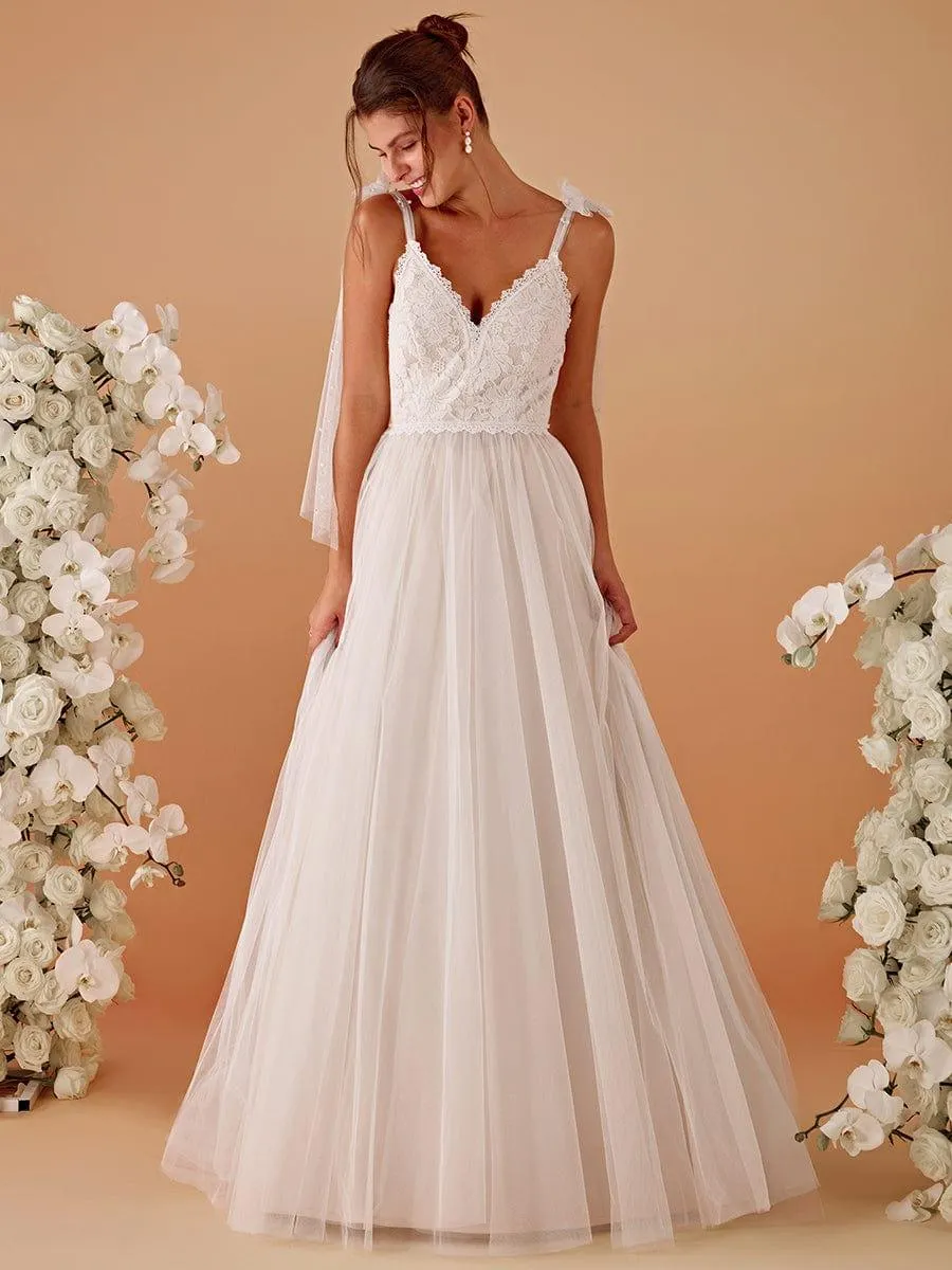 Robe de mariée romantique en dentelle et tulle avec épaules nouées