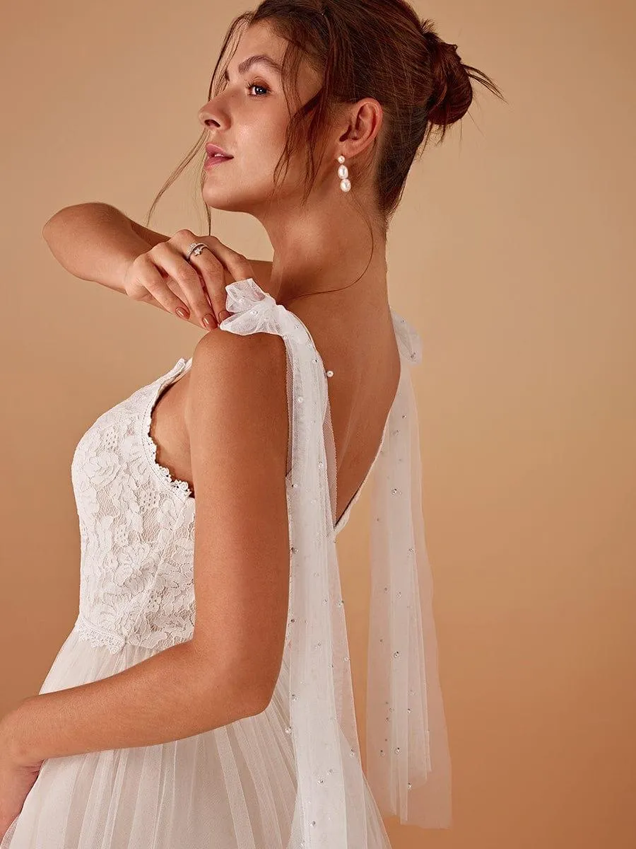 Robe de mariée romantique en dentelle et tulle avec épaules nouées