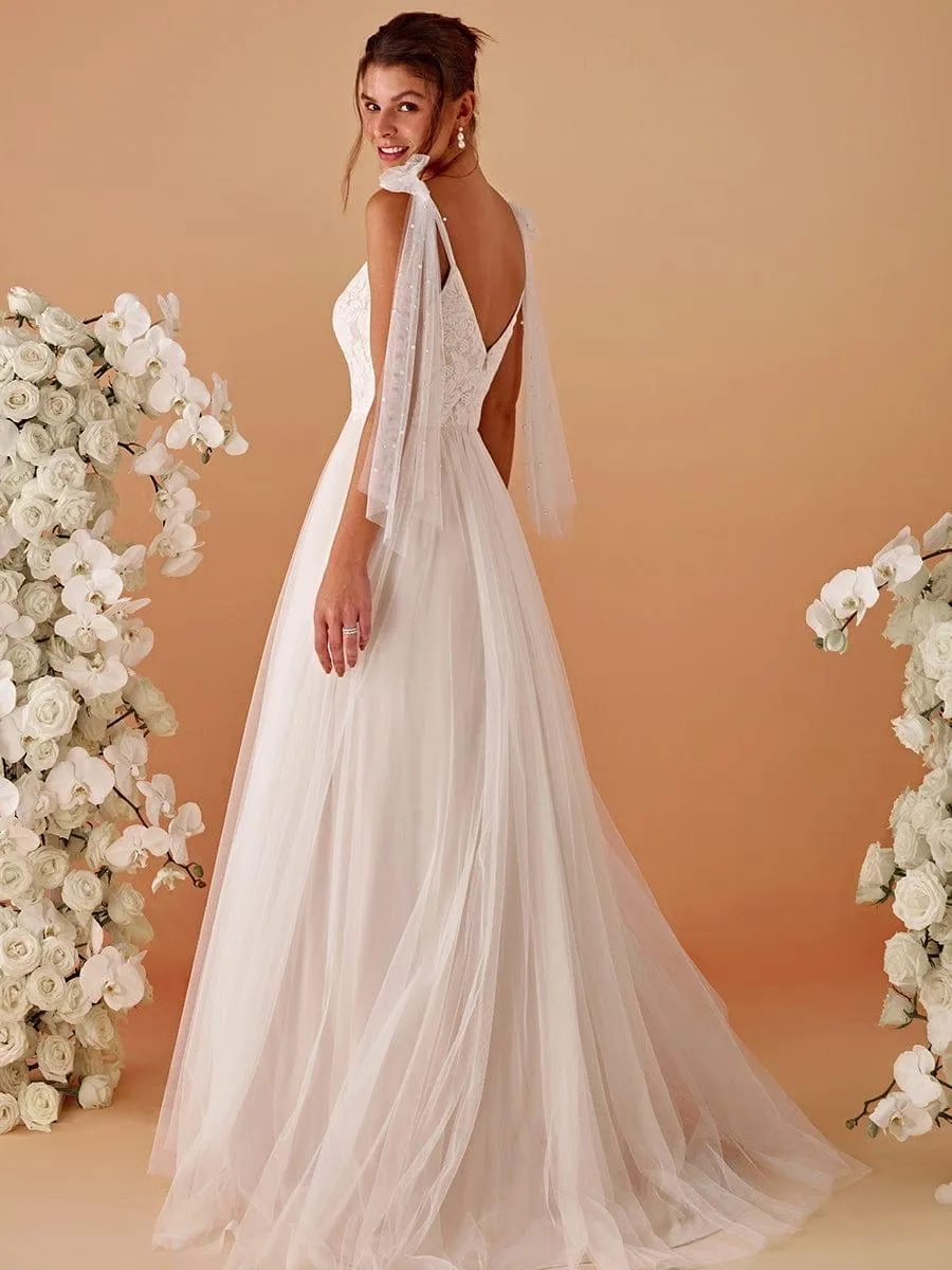 Robe de mariée romantique en dentelle et tulle avec épaules nouées