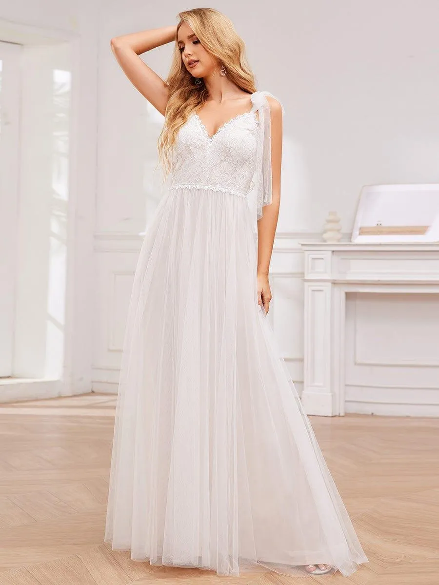Robe de mariée romantique en dentelle et tulle avec épaules nouées